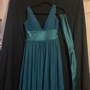 Dark green bridesmaid dress.